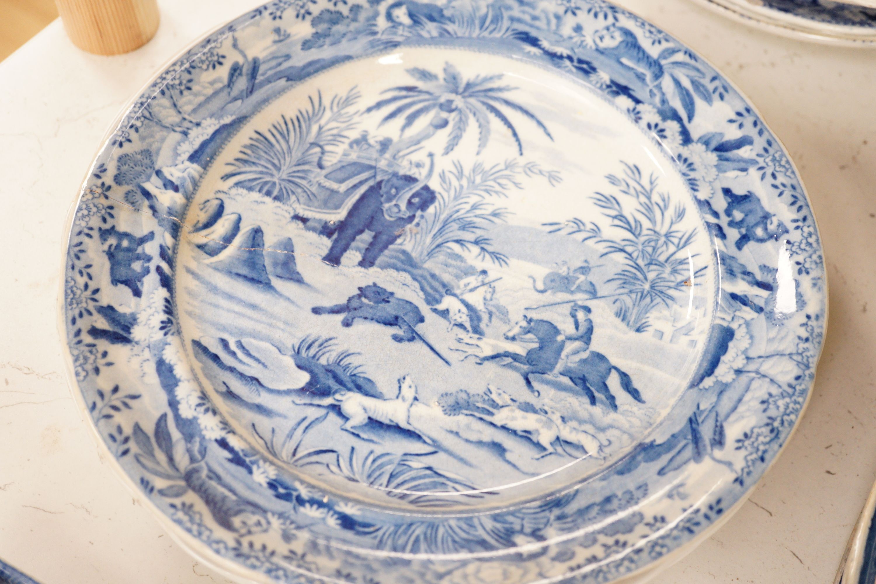 A collection of mostly 19th century blue and white transfer printed pottery tablewares